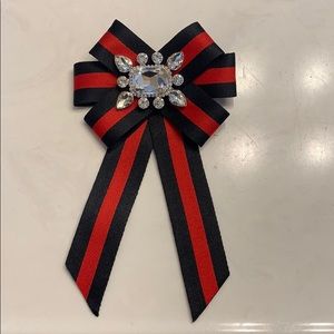 Red and black bow brooch